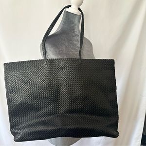 Supple genuine woven Italian leather Quince bag.